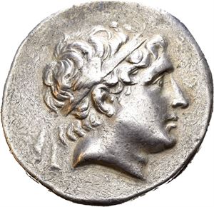 SELEUKID KINGS of SYRIA. Antiochos Hierax (246/5-227 BC.) AR tetradrachm (16,84 g). Struck at the Alexandria Troas mint. Diademed head of Antiochos II to right / ??S???OS/ANT-IOXOY, Apollo seated left on omphalos, holding arrow in right hand and grounded bow in left hand; monograms in inner and outer left fields. Horse grazing right in exergue. Numerous faint cleaning scratches and marks. Lightly toned. Very rare.