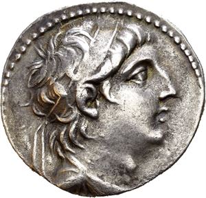 SELEUKID KINGS of SYRIA, Antiochos VII Sidetes. 138-129 BC. AR tetradrachm (14,10 g). Tyre mint, dated S.E. 174 = 139/8. Diademed and draped bust of Antiochos VII to right / BASI?EOS ANTIOXOY, Eagle standing left on prow, palm over far wing; IE above club of Tyre in left field; monogram above date (?OP)in right field; monogram between legs. Well struck and with an attractive light iridescent toning.