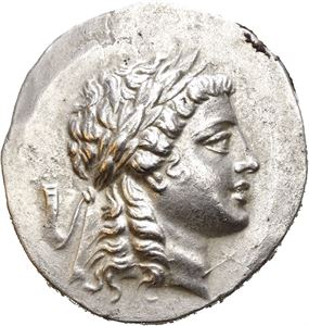 AEOLIS, Myrina. Circa 160-146 BC. AR tetradrachm (16,55 g). Stephanophoric type. Laureate head of Apollo to right / MYPINAION, Apollo Grynios standing right, holding branch and phiale; three monograms to outer left, omphalos and amphora in front of feet to right. All within laurel wreath. Reverse struck a little off centre. A few deposits on edge and a few hairlines. Well preserved surfaces with some luster.