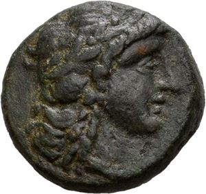 SELEUKID KINGS of SYRIA. Antiochos II Theos (261-246 BC). Æ16 (4,20 g). Sardis mint. Laureate head of Apollo to right / ??S???OS ANTIOXOY, Tripod; anchor in exergue; mongrams to outer left and right fields. Moss green patina with some earthen deposits.
