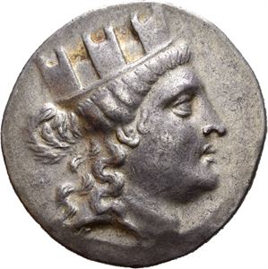 IONIA, Smyrna. Circa 170-145 BC. AR Tetradrachm (16.70 g). Menekrates, magistrate. Turreted head of the Tyche of Smyrna to right / &Zeta;&Mu;&Upsilon;&Rho;/&Nu;&Alpha;&Iota;&Omega;&Nu; in two lines and Magistrate&rsquo;s monogram below. All within laurel wreath. Slightly weak strike on obverse. Attractive light iridescent toning.