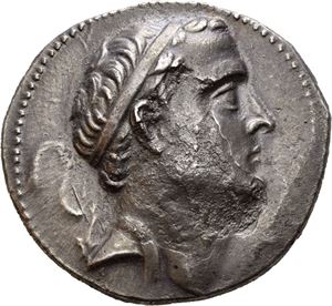 SELEUKID KINGS of SYRIA. Seleukos IV Philopator (187-175 BC). AR tetradrachm (16,63 g). Struck circa 180-175 BC at the Ake-Ptolemais mint. Diademed head of Seleukos IV to right / ??S???OS S???????, Apollo seated left on omphalos, holding arrow in right hand and grounded bow in left hand; palm branch in outer left field; monogram in inner left field; IA in exergue. Corrosion on the obverse. Wonderful old cabinet toning.