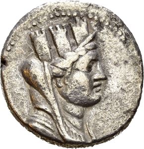 PHOENICIA, Arados. Dated year 194 (=66/65 BC). AR tetradrachm (14,83 g). Veiled and turreted bust of Tyche to right / APA?ION, Nike advancing left, holding aphlaston in her right hand and palm branch over her left shoulder; ?qP (date) above Aramaic H; ?S in lower left field. All within wreath. Minor roughness/corrosion in fields. Lightly toned.