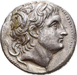 KINGS OF MACEDON, Demetrios I Poliorketes (306/5-283 BC). AR tetradrachm (16,52 g). Struck in Amphipolis 289-288 BC. Horned and diademed head of Demetrios to right / BASI?EOS ?HMHTPIOY, Nude Poseidon Pelagaios standing left with right foot on rock, holding trident in left hand and resting right arm on leg; Monogram in outer left and right fields. Some roughness on the surfaces. Toned.