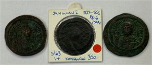 LOT #26. 3 AE folles of Justinian I. Black and dark brown patina, two with green hard deposits. Some smoothing. Three coins in lot.