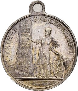 1895. Kvinne med grunnloven. Forsølvet bronse
