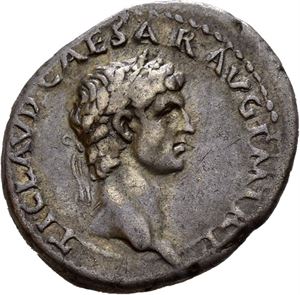 Claudius. AD 41-54. AR denarius, Lugdunum AD 46-47, (3,63 g). Laureate head of Claudius right / CONSTANTIAE AVGVSTI, Constantia seated left on curule chair, raising hand to face. A few tiny marks. Deep old cabinet toning.
