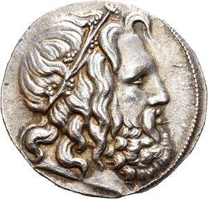 KINGS OF MACEDON, Antigonos III Doson (229-221 BC). AR tetradrachm (17,02 g). Struck in Amphipolis circa 227-221 BC. Head of Poseidon to right, wreathed with seaweed / BA&Sigma;I&Lambda;E&Omega;&Sigma; ANTI&Gamma;ONOY, Apollo seated on prow, holding bow; monogram in lower field. A superb coin with well preserved surfaces and a wonderful golden toning around devices.