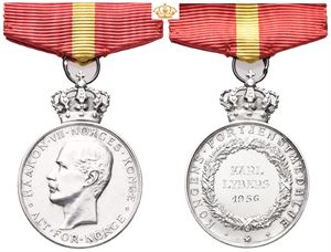 Haakon VII. Kongens fortjenstmedalje. Throndsen. Sølv. 28 mm med krone og bånd