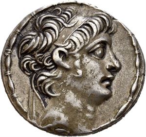 SELEUKID KINGS of SYRIA, Antiochos X Eusebes. Circa 94-88 BC. AR tetradrachm (16,11 g). Antioch on the Orontes mint, struck circa  BC. Diademed head of Antiochos X to right, with sideburns / BASI?EOS ANTIO?OY EYSEBOYS FI?O?ATOPOS, Zeus enthroned to left, holding Nike and resting on sceptre; monogram above A in outer left field; ? beneath throne. All within laurel wreath. Well preserved surfaces. Toned.