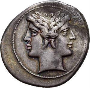 Anonymous. Circa 225-215 BC. AR quadrigatus, (6,55 g). Uncertain mint. Laureate head of Janus; curved truncation / Jupiter advancing right in quadriga driven by Victory, hurling thunderbolt and holding sceptre; ROMA incuse on raised tablet in exergue. Struck on a broad flan. Area with encrustation/oxidation. A few tiny marks. Lovely steel grey toning with some blue iridescence.