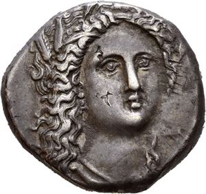 LUCANIA, Metapontum. Circa 330-290 BC. AR nomos, (7,77 g). Head of Demeter facing 3/4 right, wearing stephane and wreathed with grain; small &Alpha;&Pi; to lower right / META, Grain ear with leaf to right; boukranion above leaf, A&Theta;A below leaf (out of flan). Small die flaw on obverse. Attractive dark old cabinet toning with tiny patches of horn silver.