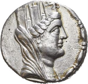 SYRIA, Laodikeia by the Sea. Dated year 18 (=64/63 BC). AR tetradrachm (14,84 g). Veiled and Turreted bust of Tyche to right / ?AO?IKEON THSIEPAS KAI AVTONOMOV, Zeus enthroned to left, holding Nike in right hand and resting on scepter with left hand; monogram beneath throne; HI (date) in left field; KA in exergue. All within wreath. Some horn silver on the reverse. A few old marks and small scratches. Lightly toned. Rare variant!
