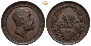 1887 Landbruksmøtet i Trondheim. 35mm, bronse. Hull i kanten etter anheng.