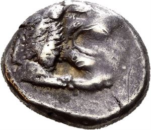KARIA, Knidos. Circa 520-495 BC. AR drachm (6,18 g). Forepart of roaring lion right / Archaic head of Aphrodite right within incuse square. Obverse struck with worn dies. A few shallow marks scratches on obverse. Wonderful deep iridescent cabinet toning.