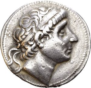 SELEUKID KINGS of SYRIA. Antiochos I Soter (281-261 BC). AR tetradrachm (16,98 g). Seleukeia on the Tigris mint. Struck circa 296/5-281 BC. Diademed head of Antiochos I to right / ??S???OS ANTIOXOY, Apollo seated left on omphalos, holding arrow and grounded bow; monograms in outer left and right field. Tiny mark on cheek. Lightly toned.