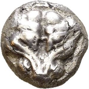 IONIA, Miletos. Late 6th-5th centuries BC. AR 1/16 stater (0,73 g). Facing lion scalp / Floral or stellate design within incuse square. Lightly toned.