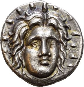 ISLANDS off CARIA, Rhodes. Circa 250-230 BC. AR didrachm (6,49 g). Timotheos, magistrate. Head of Helios facing 3/4th to right, rays around head / &Tau;&Iota;&Mu;&Omicron;&Theta;&Epsilon;&Omicron;&Sigma; (magistrate), Rose with one bud to right, herme standing to left; P-O below rose. Very minor corrosion on obverse. Wonderful iridescent toning.