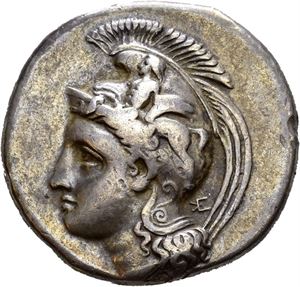 LUCANIA, Velia. Circa 334-300 BC. AR nomos, (7,40 g). Kleudoros group. Helmeted head of Athena left; monogram behind neck / YE&Lambda;HT&Omega;N, Lion standing left, tearing at prey; &Theta; above, monogram below. Edge marks and some edge filing. Well struck and with a wonderful deep old cabinet toning.