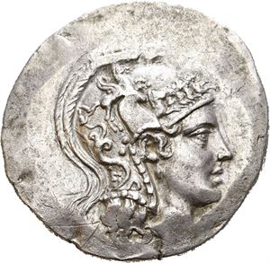 IONIA, Herakleia ad Latmon. Circa 150-142 BC. AR tetradrachm (16,09 g). Head of Athena to right, wearing crested Attic helmet / HPAK?EOTON, Club; below, Nike advancing left, holding wreath, two monograms on each side. All within oak wreath. Areas of weak strike. A few small scratches.