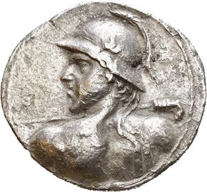 BAKTRIA, Greco-Baktrian Kingdom. Eukratides I Megas (circa 170-145 BC). AR tetradrachm (15,15 g). Diademed heroic bust of Eukratides to left, wearing horned Boiotian helmet and brandishing spear / BASI?EOS MEGA?OY E?K?ATI?OY, The Dioskouroi twins on horses riding right, holding palm blanches and spears; monogram in lower right field. Corroded surfaces. Lightly toned. Rare.