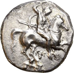 CALABRIA, Taras. Circa 332-302 BC. AR didrachm (7,73 g). Warrior on horseback charging right, spearing downward and holding shield and two other spears / TAPAS, Taras astride dolphin, riding left and holding trident and decorated shield. Counch or murex shell below. Well centered for type. Lightly toned.