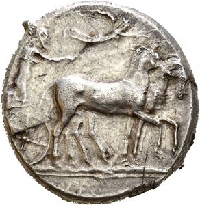 SICILY, Syracuse. Circa 430 BC. AR tetradrachm (17,60 g). Struck under the Second Democracy. Slow quadriga advancing right; above, Nike flying right, crowning horses / &Sigma;YPAKO&Sigma;ION, Head of Arethousa right, hair in sakkos ornamented by a maeander pattern; four dolphins swimming clockwise around. Obverse struck from slightly worn dies. Lightly toned with iridescense around the details. Rare.