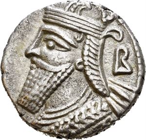 KINGS of PARTHIA. Vologases IV (circa AD 147-191). BI tetradrachm (13,79 g). Seleukeia on the Tigris mint. Dated year 467 SE (= AD 155). Diademed and draped bust of Volugases to left, wearing tiara; large B behind bust / King seated left on throne, Tyche standing before him, presenting a diadem and holding sceptre;  Z?V (year) above, month (off flan) in exergue.